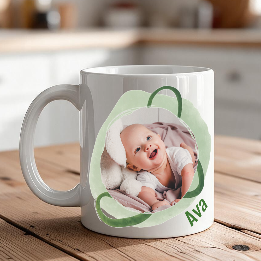 Watercolor accent 2-photo personalized mug with custom name
Artistic photo mug with name on kitchen counter
Close-up of watercolor accent and name lettering on ceramic mug